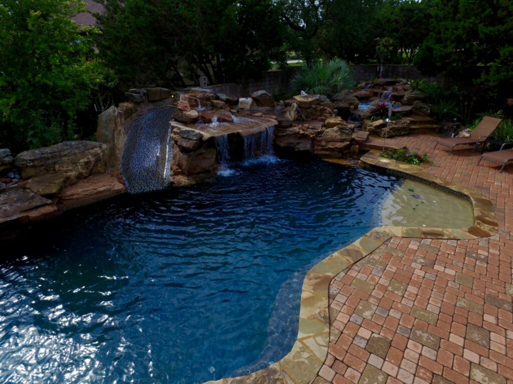 Freeform pool & spa with grotto waterfall