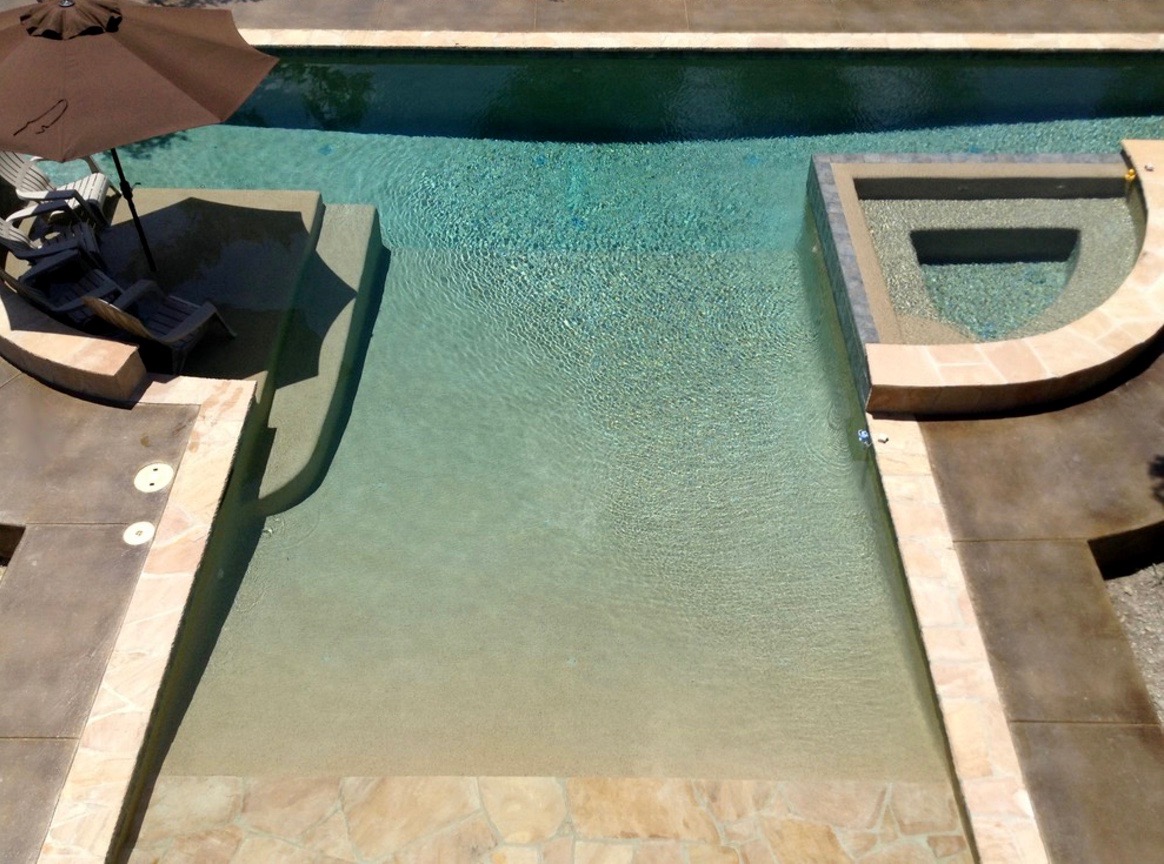 Custom Pool with Olympic swim lane, Beach entry, sunshelf and spa