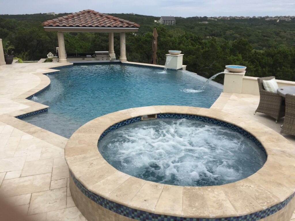 Custom Pool with Pergola swim up bar and outdoor kitchen